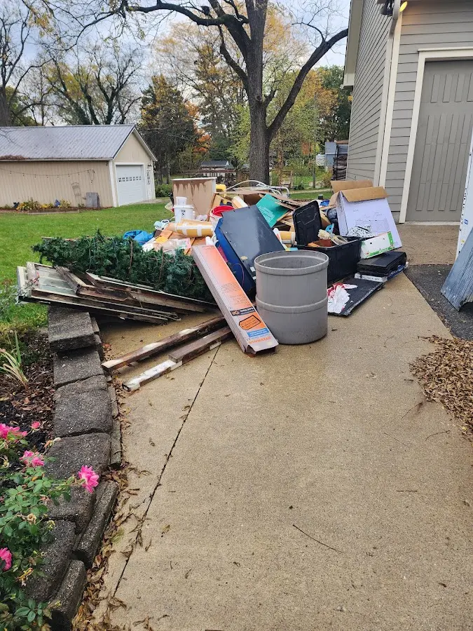 Dumpster being loaded with debris for Demolition Dumpster Rental in Newton